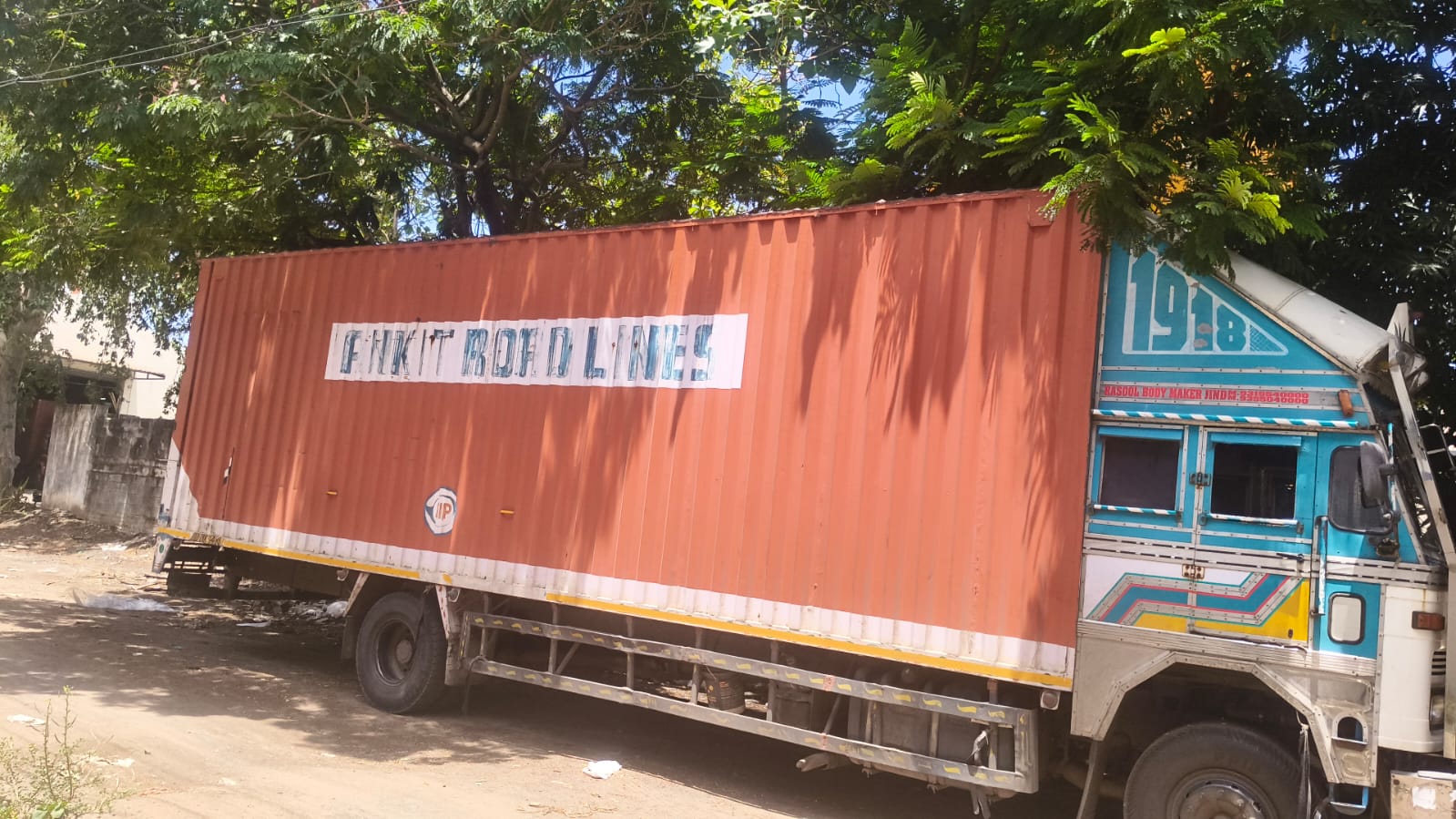 Open body truck on highway — heavy cargo freight transport by Ankit Roadlines